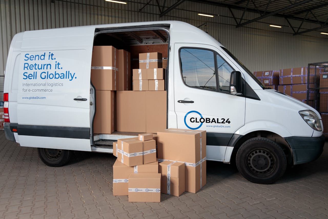 services-03 Delivery van loaded with cardboard boxes for global shipping logistics.
